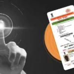 Aadhaar biometric authentication showing a fingerprint scan and Aadhaar card, representing digital identity verification in India
